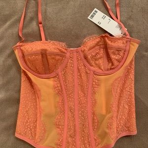 NWT urban outfitters out front under corset in rust color, size M